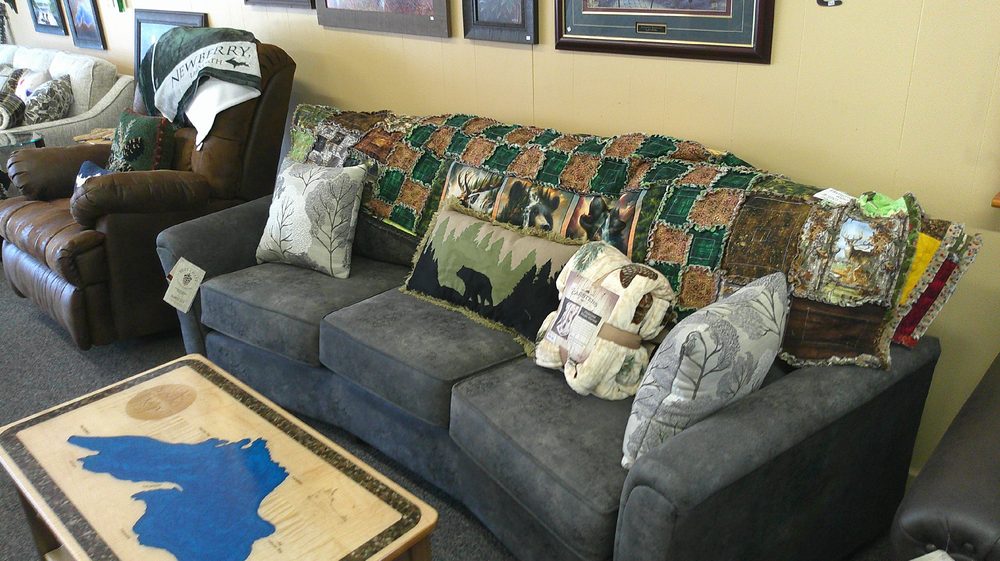 Sectional sofa styled with a Newberry blanket and moose-themed pillows