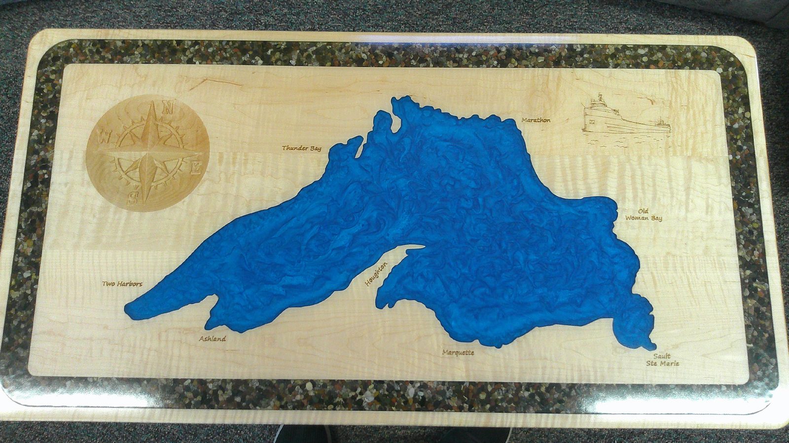 Coffee table with a hand-inlaid map of Lake Superior worked into the wood grain